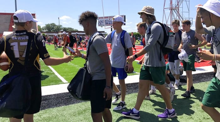 Trevor Lawrence goes full camp counselor in his bucket hat and purple Nikes.